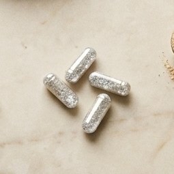Silver mineral capsules on marble